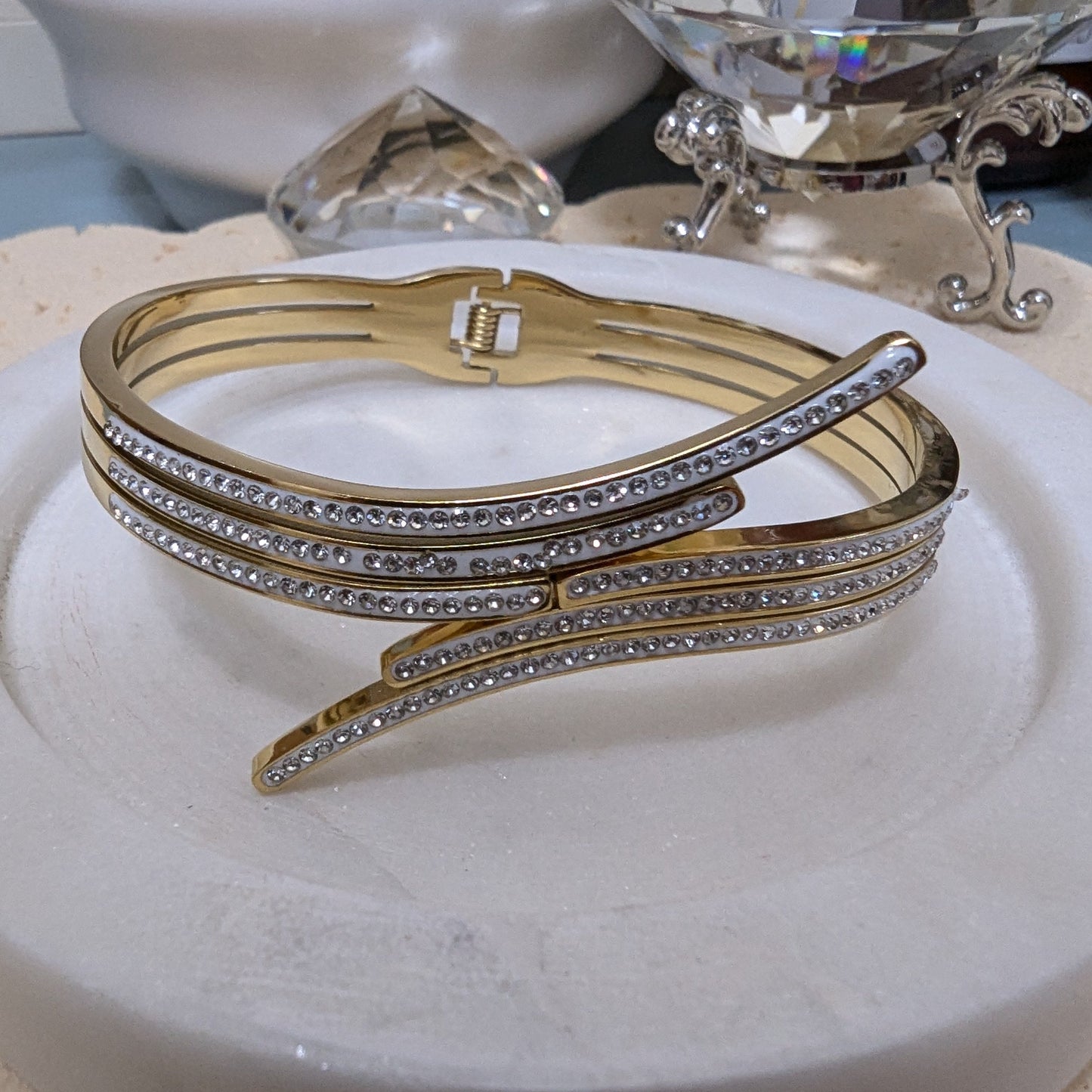 gold bracelet accented with rows of cubic zirconia and rhinestones