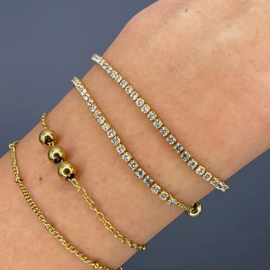 Cubic Zirconia Adjustable Bracelet on a wrist with layered bracelets 4 bracelets on wrist