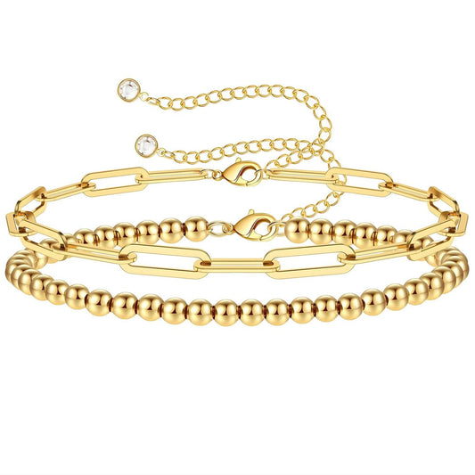 Gold layered bracelet set with paperclip chain and polished bead strand, made from stainless steel and finished in 18K gold PVD plating, waterproof and hypoallergenic.