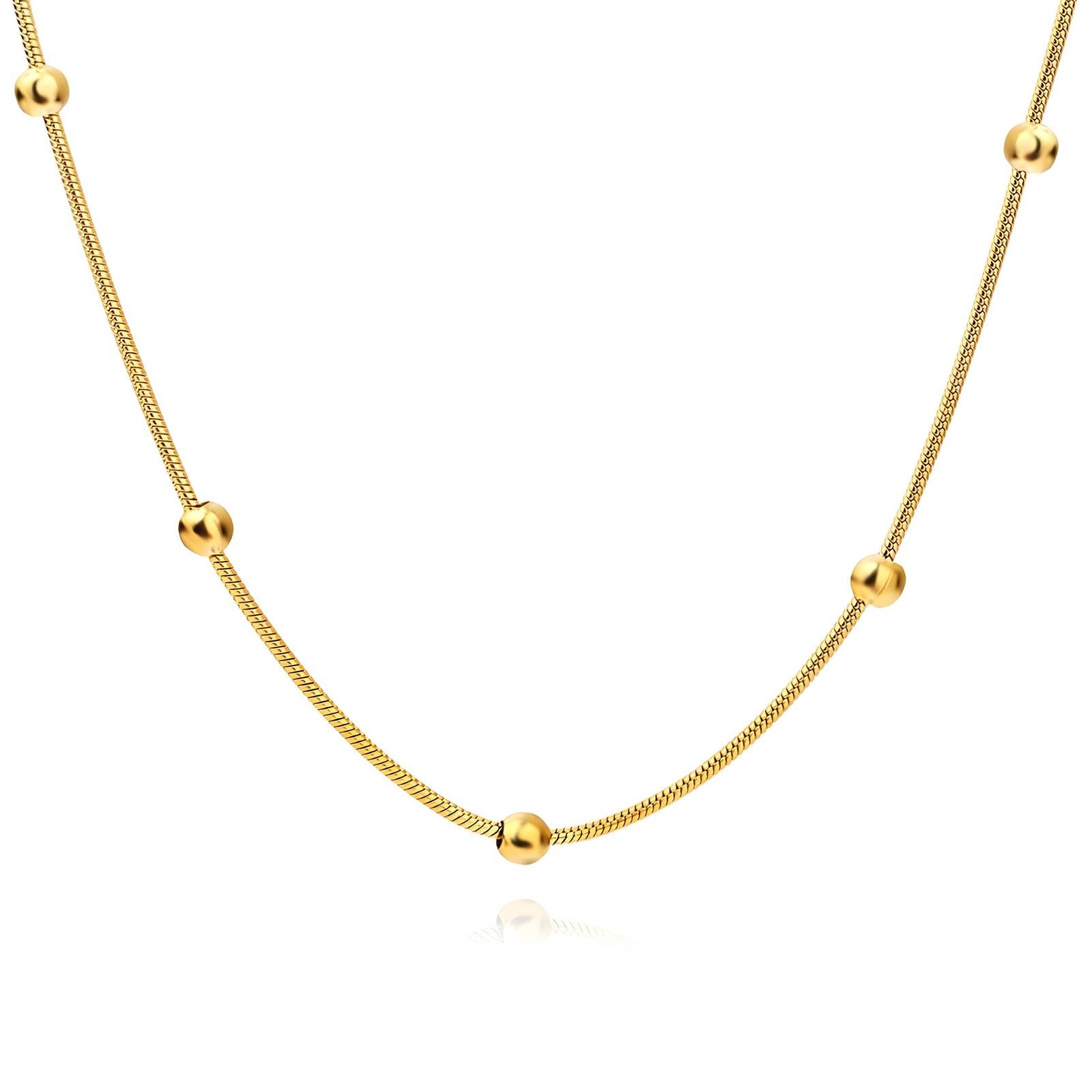 Gold snake chain necklace with spaced beaded accents, made from stainless steel with 18K gold PVD plating, waterproof and hypoallergenic.
