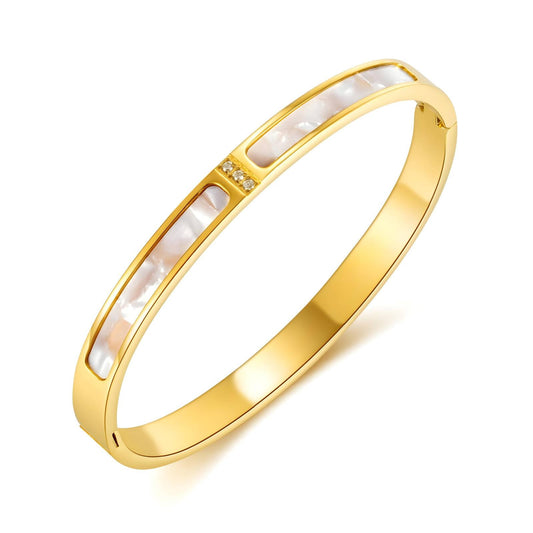 Gold bangle bracelet with mother of pearl inlays and cubic zirconia accents, crafted from stainless steel with 18K gold PVD plating, waterproof and hypoallergenic.