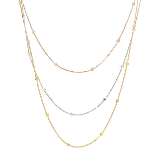 Flat-lay view of gold, silver, and rose gold beaded chain necklaces, made from stainless steel with 18K gold PVD plating, waterproof and hypoallergenic.