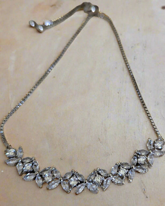 Silver plated flower zircon bracelet with clear crystal stones, adjustable slide lock design – perfect for bridal or special occasion wear